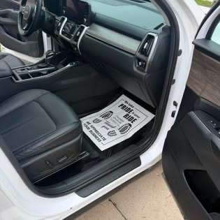 Finished front seats and door sill on a white SUV